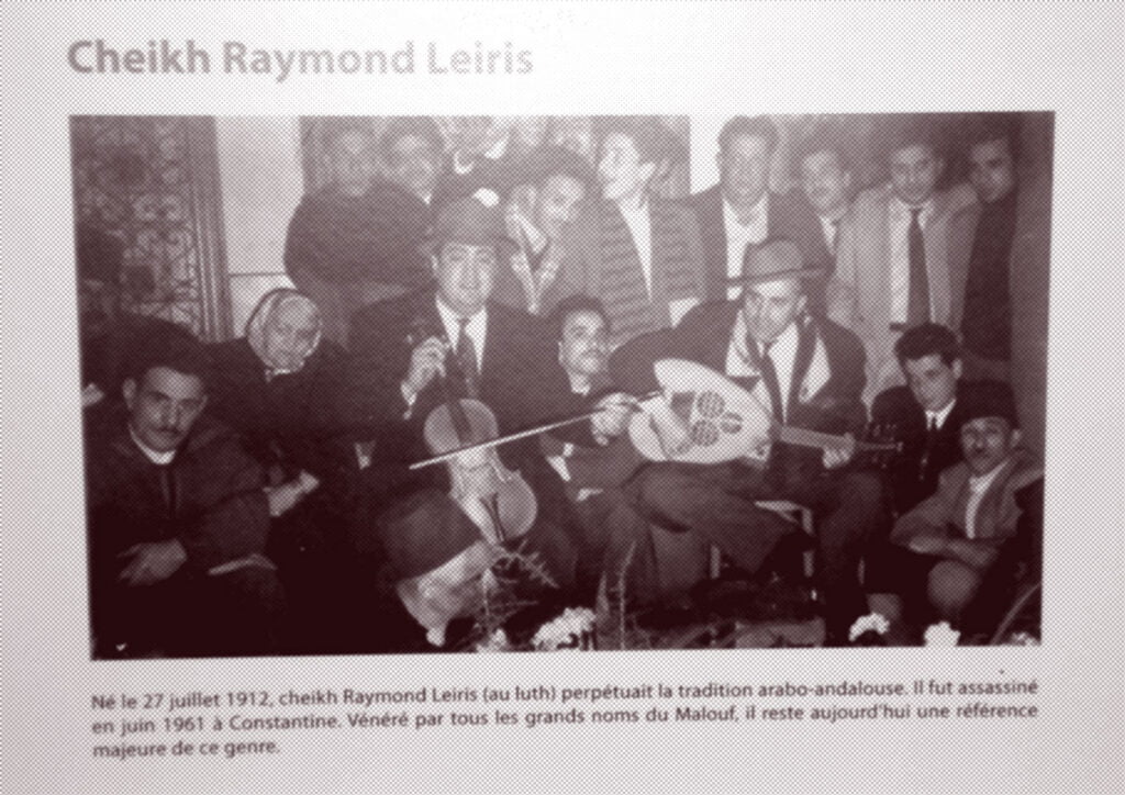 A photo of a poster from the exhibit of Jewish-Arab musicians, at the Festival des Andalousies Atlantiques, Essaouira, Nov. 2007. The master of malouf (the Constantine version of Andalusian traditional music), Cheikh Raymond Leiris, playing the 'ud. On his right is Sylvain Ghrenassia (father of Enrico Macias/Gaston Ghrenassia), on violin.