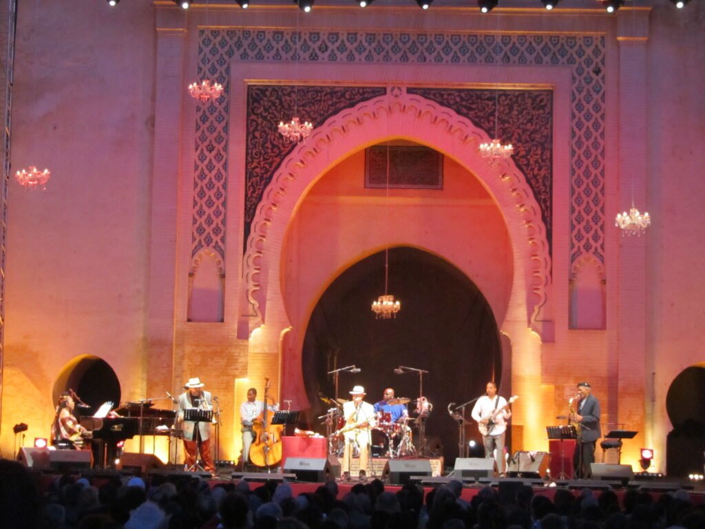 A group of musicians performing on stage during the Fes Festival of World Sacred Music in 2012.