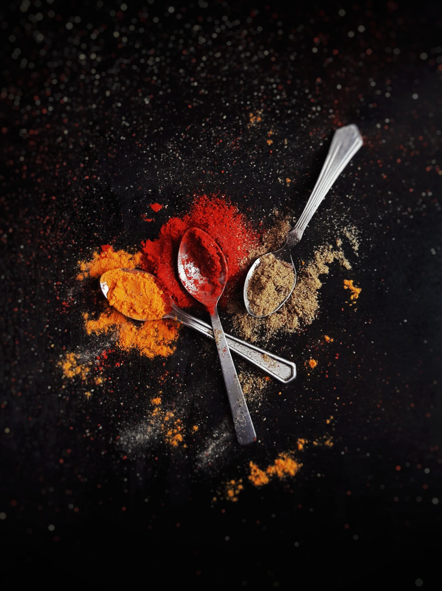 A photo of Moroccan seasoning powder with various spices, including cumin, coriander, paprika, and turmeric, representing the different flavor profiles found in Moroccan spices.