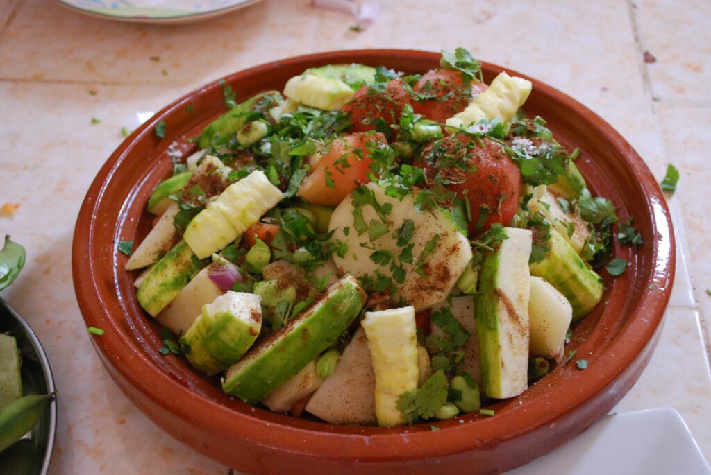 Fresh vegetables and spices in a Tajine pot for perfect home-cooked Tajine - Tips and Tricks for Cooking at Home