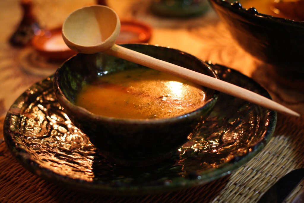 Image of a bowl of Moroccan Harira Soup, a staple dish in Moroccan cuisine, often served during special occasions like Ramadan. This image represents the history and cultural significance of the dish.