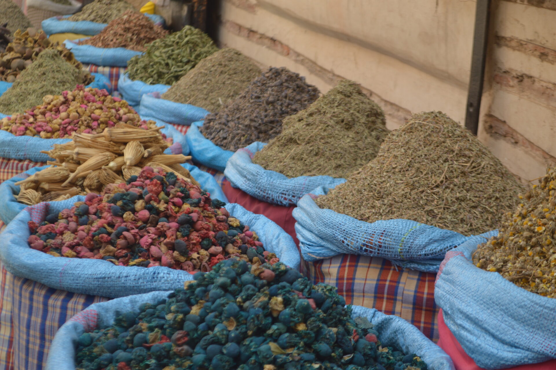 Assorted Moroccan spice blends and ingredients arranged in stacks for future spice innovation and experimentation