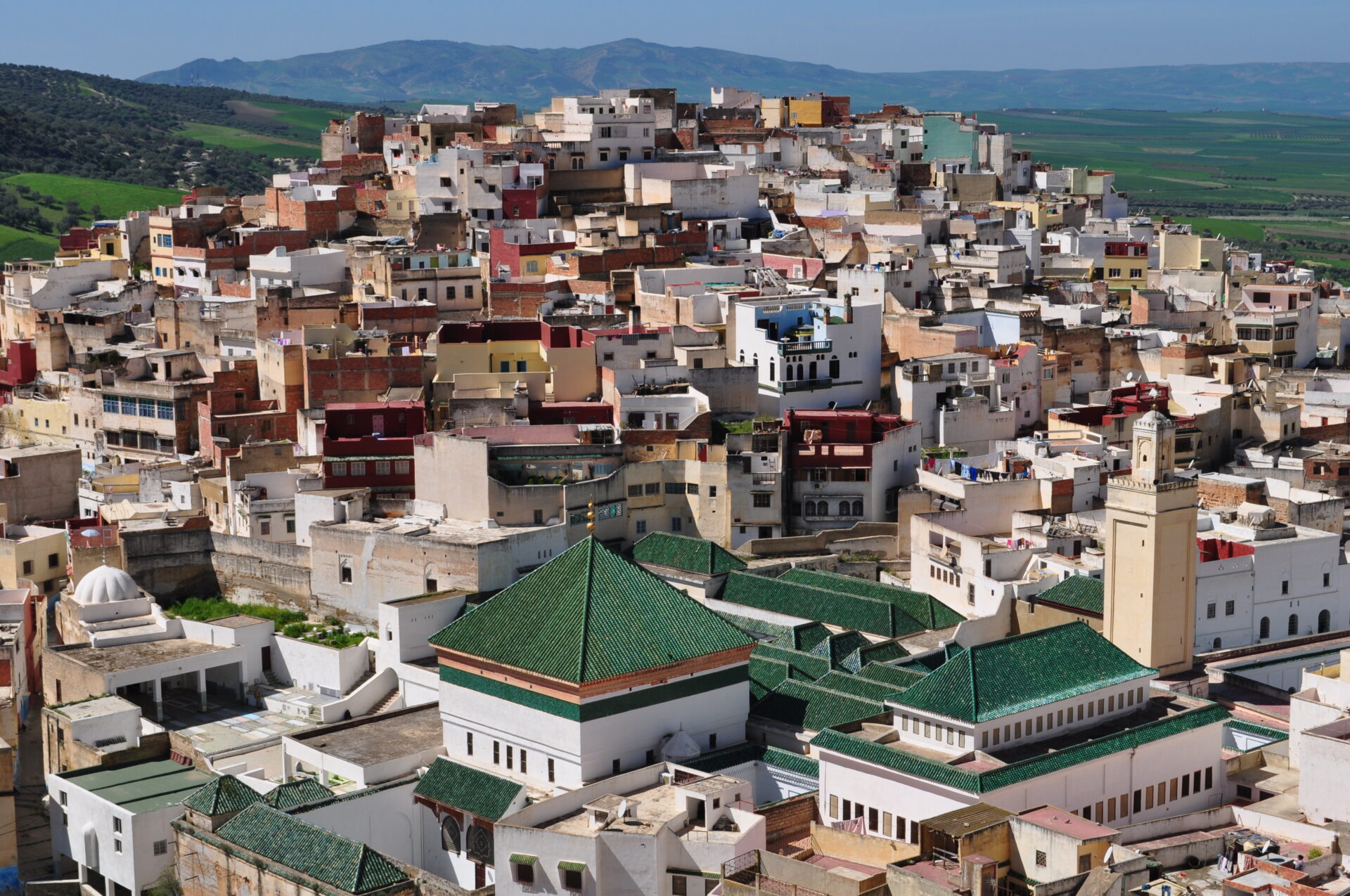 View of Moulay Idriss, a holy city in Morocco with traditional buildings and greenery