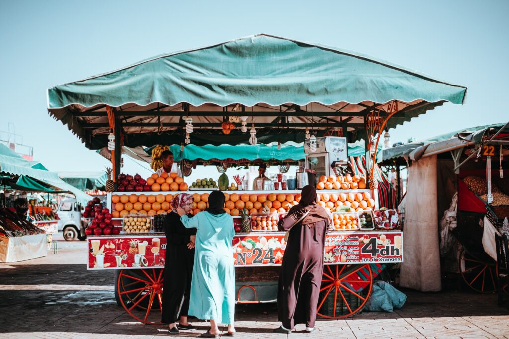 A caravan selling fresh orange juices in Marrakech, showcasing the vibrant and flavorful culinary culture of Morocco.