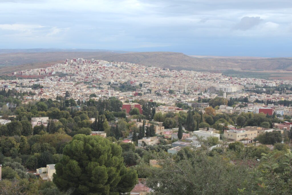 A picture of the city of Sefrou in the Fes region, with the ancient synagogue in the foreground, representing Morocco's diverse heritage.