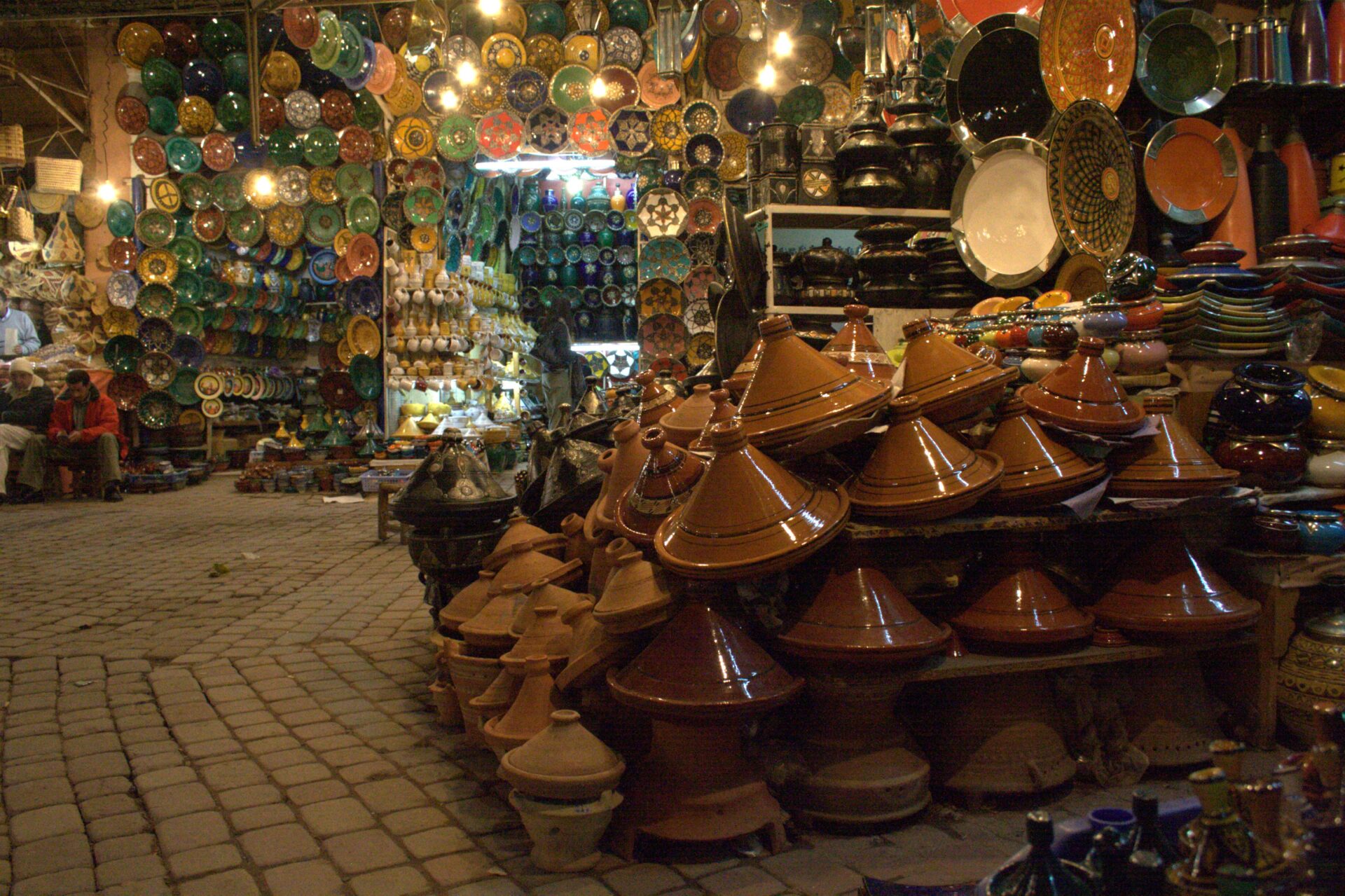 Various types of Tagines on display in a Moroccan shop, showcasing the diversity and uses of Tagines in Moroccan cuisine