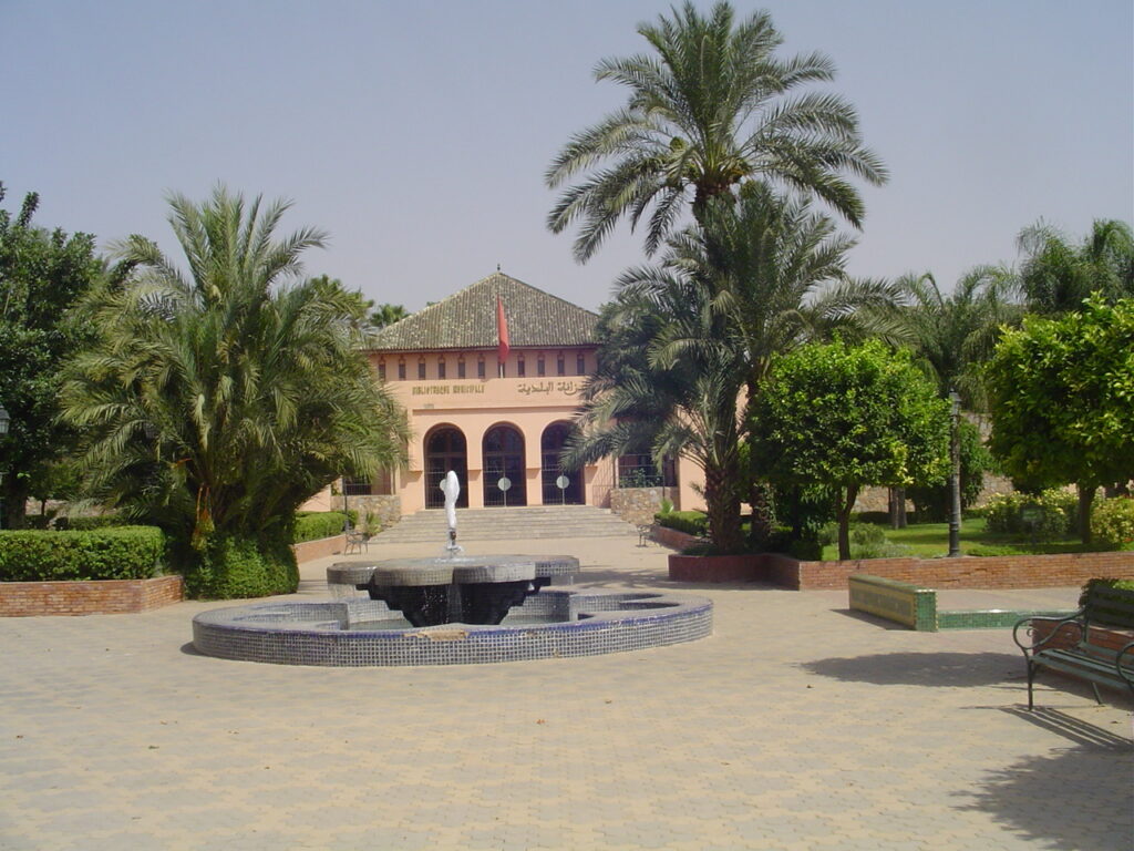 Serene courtyard and gardens of the Koutoubia Mosque with a beautiful fountain.