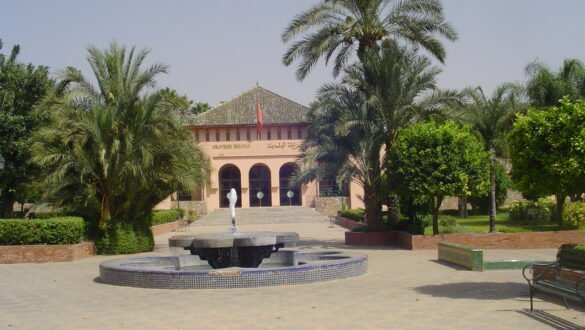 Serene courtyard and gardens of the Koutoubia Mosque with a beautiful fountain.