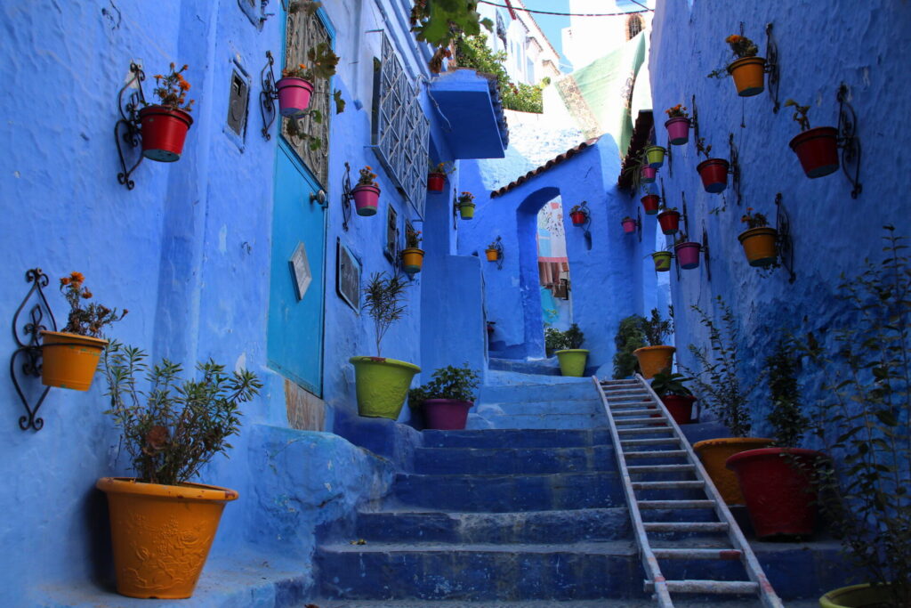 Vibrant blue streets of Chefchaouen, a captivating city in Morocco known for its enchanting charm and vibrant atmosphere.