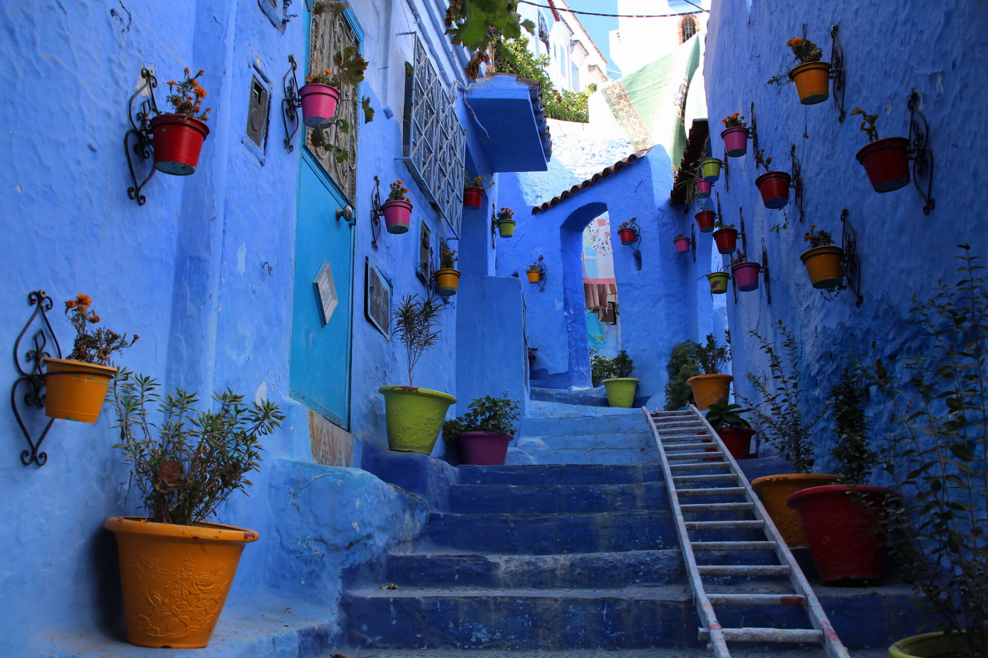 Vibrant blue streets of Chefchaouen, a captivating city in Morocco known for its enchanting charm and vibrant atmosphere.