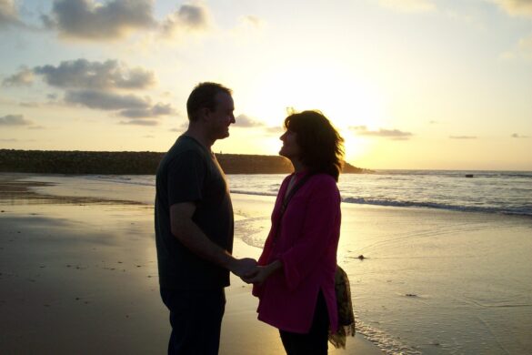 Unmarried couple enjoying a beautiful sunset in Asilah, highlighting considerations for travelers in Morocco.