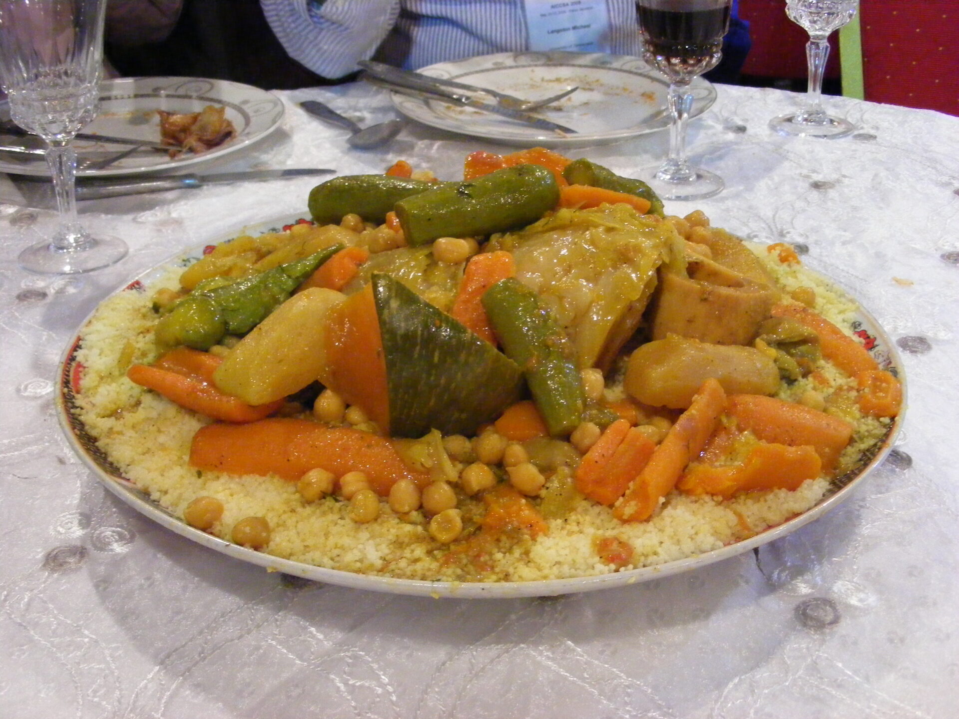 Image of a lavish banquet in Rabat, Morocco, featuring the Moroccan national dish - couscous. A tantalizing culinary journey through rich flavors and cultural heritage.