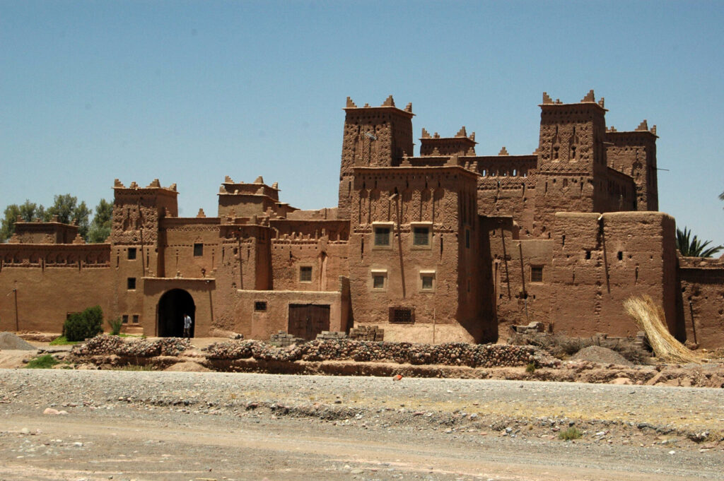 Amerhidil Qasbah - A 15th-century qasbah nestled within a lush palm grove near Skoura, Morocco, showcasing traditional Moroccan architecture and serene natural surroundings