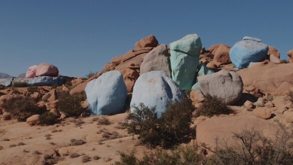 Vibrant colored rocks in Tafraout, Morocco, showcasing stunning geological formations amidst a scenic landscape