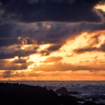 Sunset view over the Atlantic Ocean from the walls of Essaouira, Morocco, showcasing the the temperature in April.