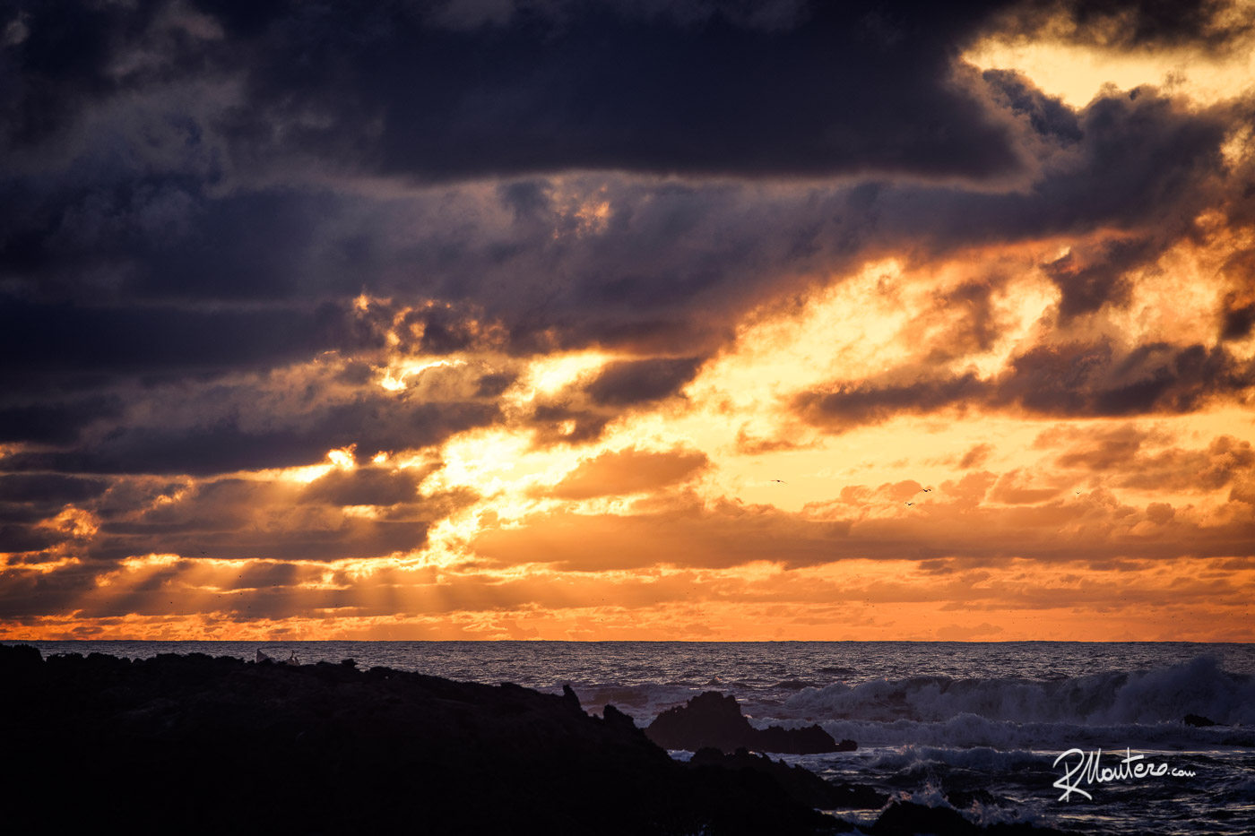 Sunset view over the Atlantic Ocean from the walls of Essaouira, Morocco, showcasing the the temperature in April.